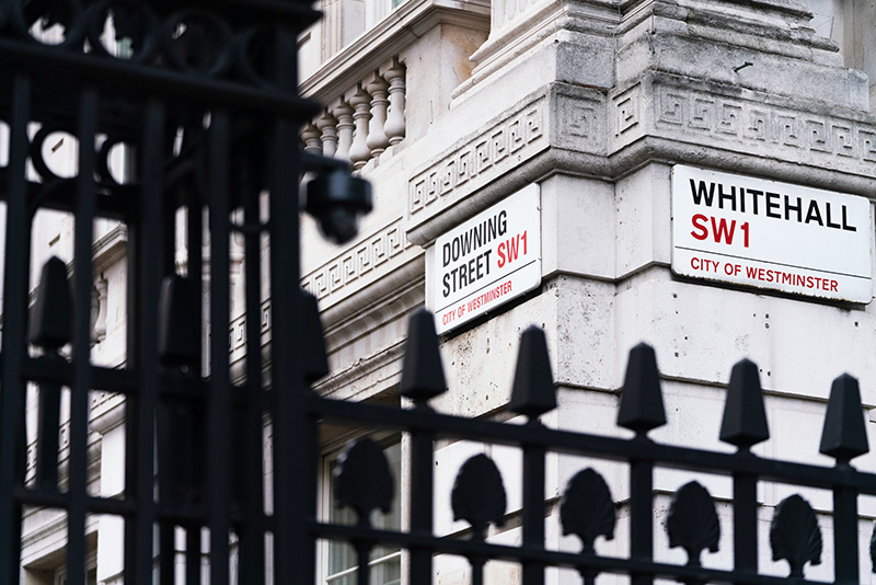 Street signs for Downing Street and Whitehall